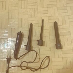 Herstyler 3 in 1 a clipless curling iron‎